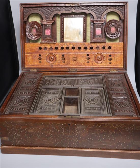 A large Indian brass inlaid teak vanity box, late 19th century, with fitted interior, 54.5cm wide